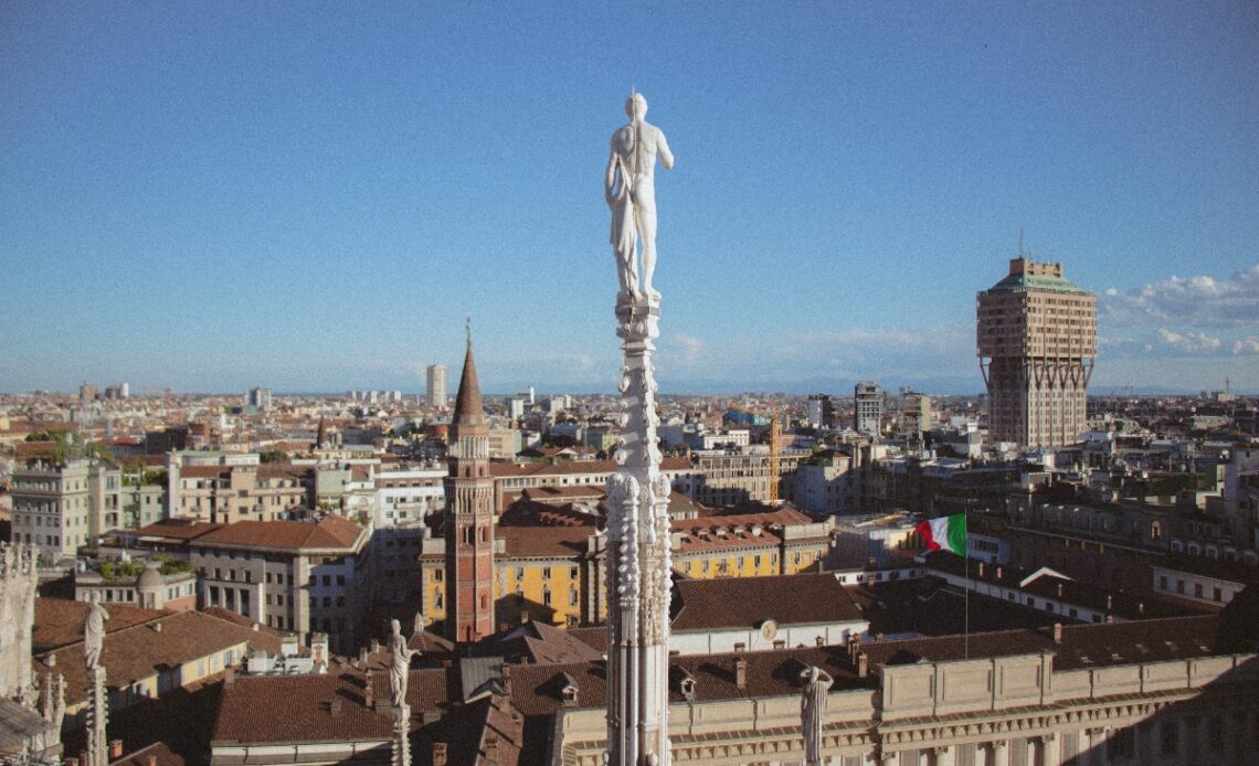 where to stay in milan with cathedral statue overlooking the city