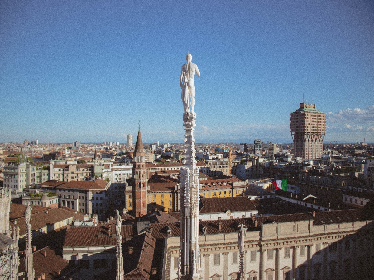 where to stay in milan with cathedral statue overlooking the city
