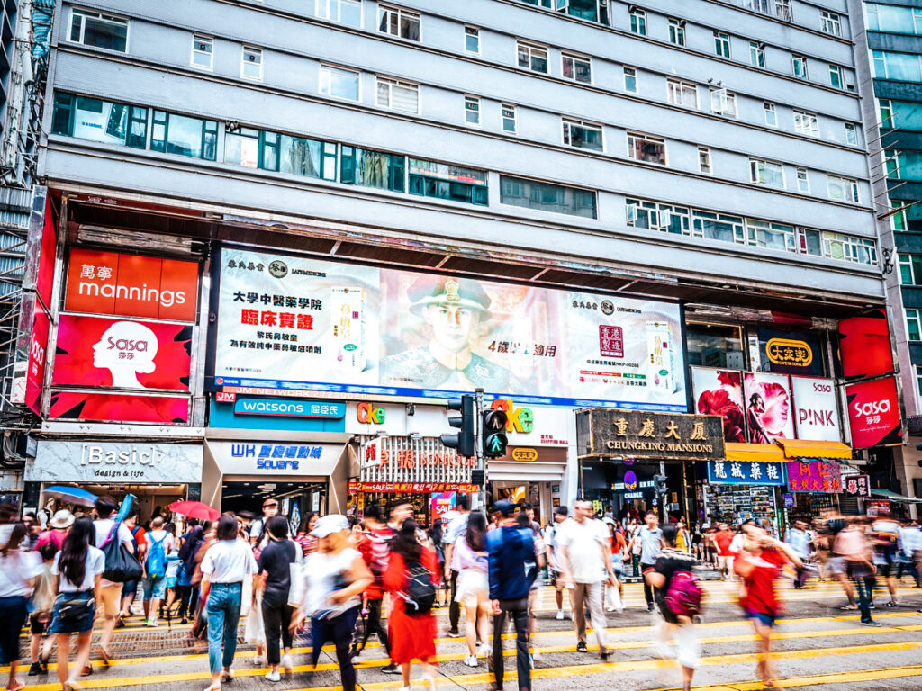 people walking around outside chungking mansion