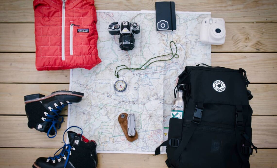 A map, backpack, and other gear for travel