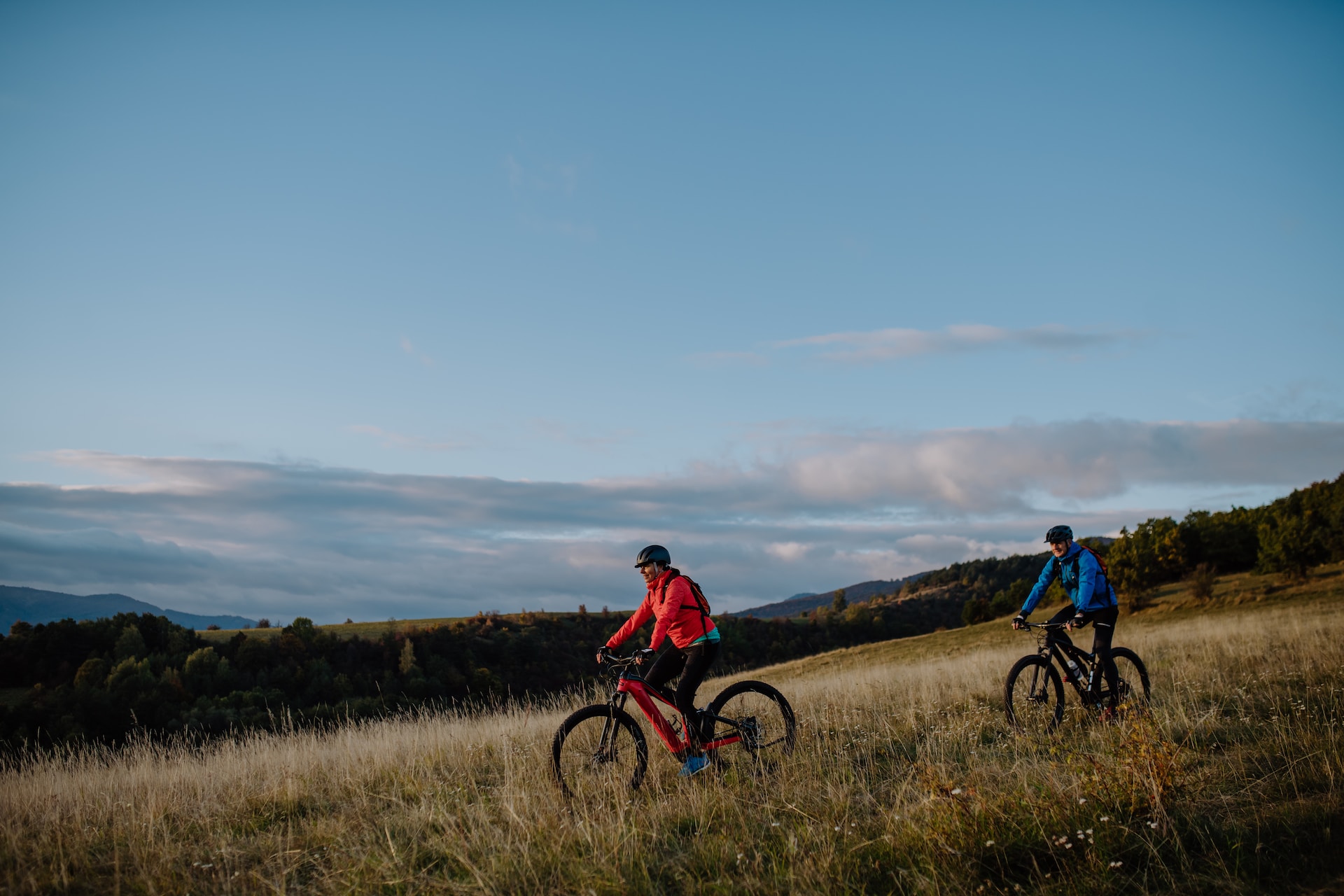 E-bike riders in a field (photo: Unsplash+ License / Getty Images)