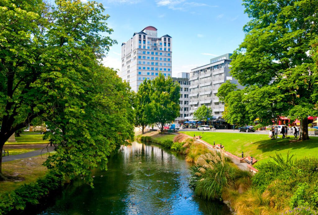 buildings beside river in christchurch city scape