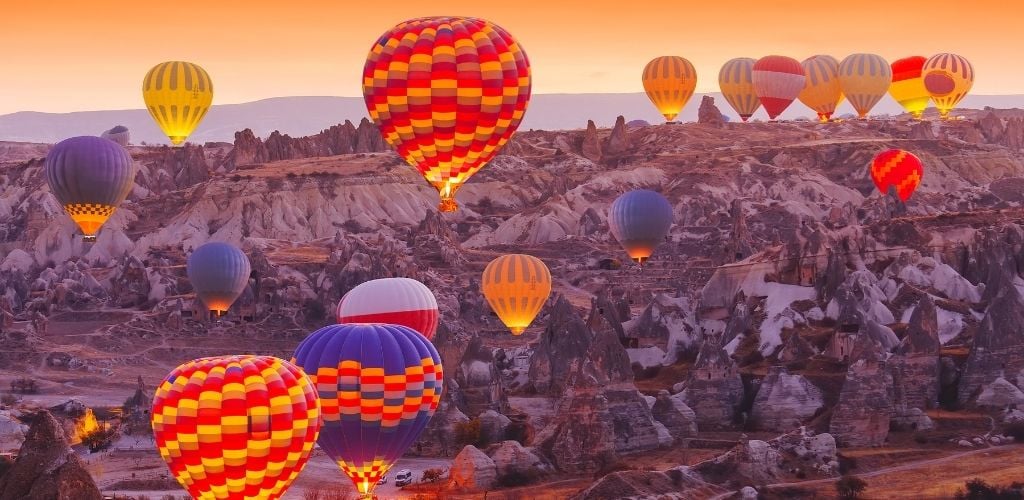 Beautiful vibrant colorful balloons in sunrise in Cappadocia. 