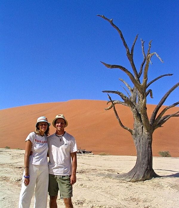 caz and craig in front of dead tree and sand dune