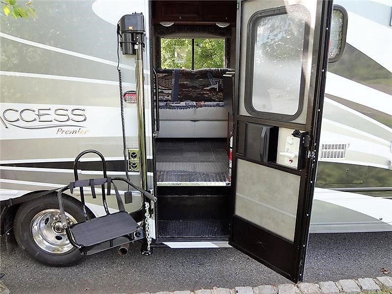 CoachLift installed beside the door of a Class C RV