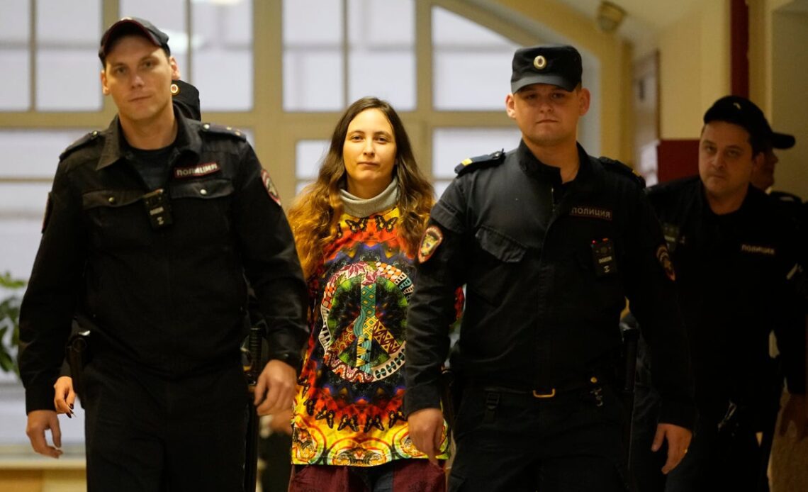 Russian artist jailed for staging anti-war supermarket protest as Putin pardons murderer of Kremlin-critic