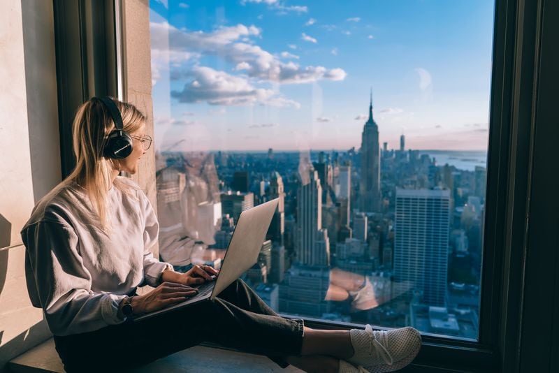 Cybersecurity tips for travelers digital nomad in headphones