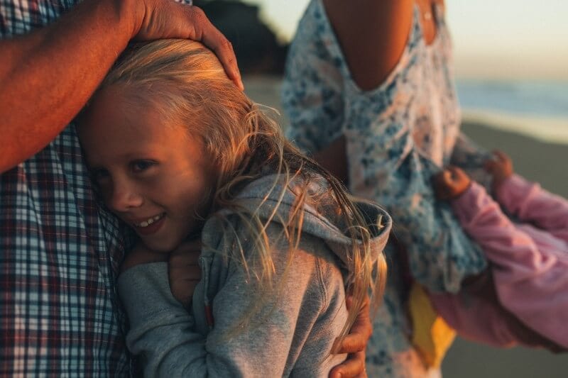 father hugging daughter