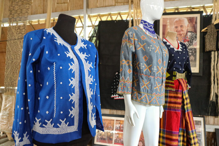 Woven and beaded products are displayed in Fu Yabing’s home.