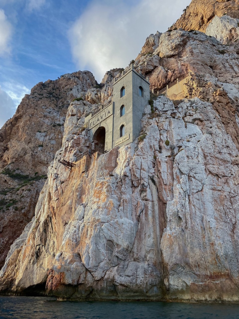 The Porto Flavia mine seen from the sea, inside the promontory overlooking Masua, a hamlet of Nebida in Iglesias, southern Sardinia