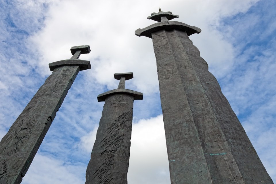 Three large swords stand on the hill as a memory to the Battle of Hafrsfjord in year 872, when King Harald Fairhair gathered all of Norway under one crown. The largest sword represents the victorious king, and the two smaller swords represent the defeated kings.