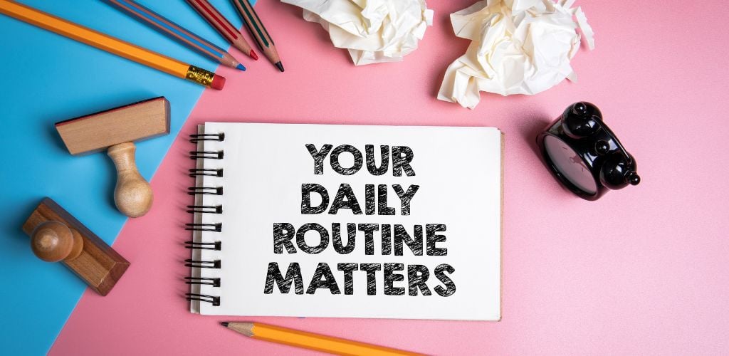 Your daily routine matters. Handwriting text in the notebook.