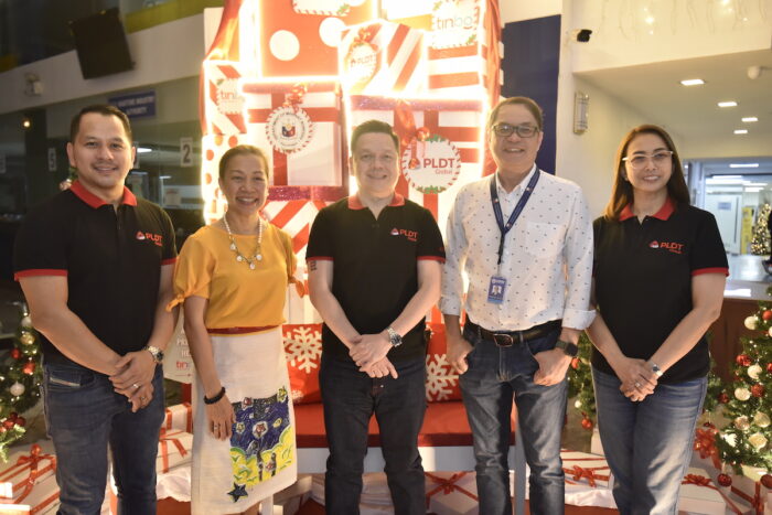 PLDT Global and the Department of Migrant Workers leaders illuminate the spirit of Christmas by unveiling the TINBO Christmas Display at the Blas Ople Building, a symbol of commitment to OFWs and their families. (L-R) Mr. Artemio Quiamas, PLDT Global VP Strategic Partnerships; Usec. Maria Anthonette Velasco-Allones, DMW Undersecretary for Finance & Internal Affairs; Mr. Albert Villa-Real, President and CEO, PLDT Global; Usec. Bernard P. Olalia, DMW Undersecretary for Licensing & Adjudication Services; and Ms. Edith Gomez-Cudiamat, PLDT Global First Vice President & Chief Operating Officer