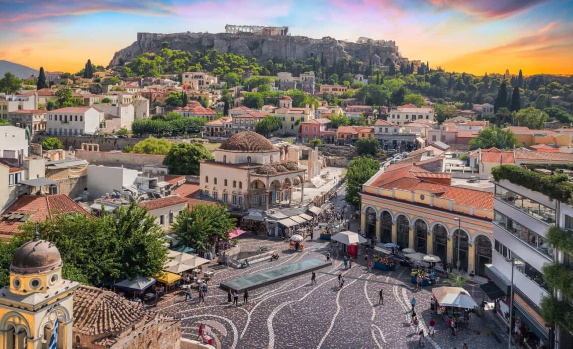 The old town of Athens at sunset with the Acropolis in the distance