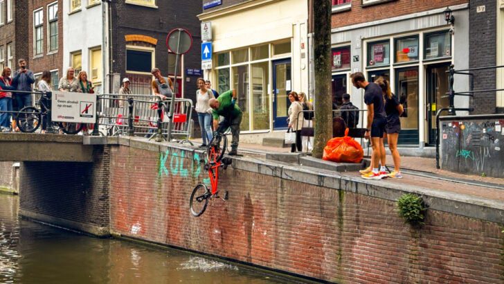 Man Fishing Bikes Out of the Amsterdam Canals