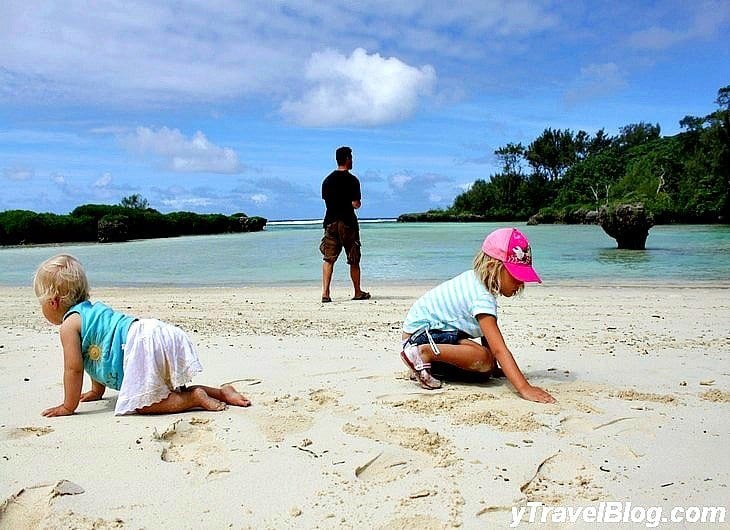 baby and toddler playing on sand in Vanuatu