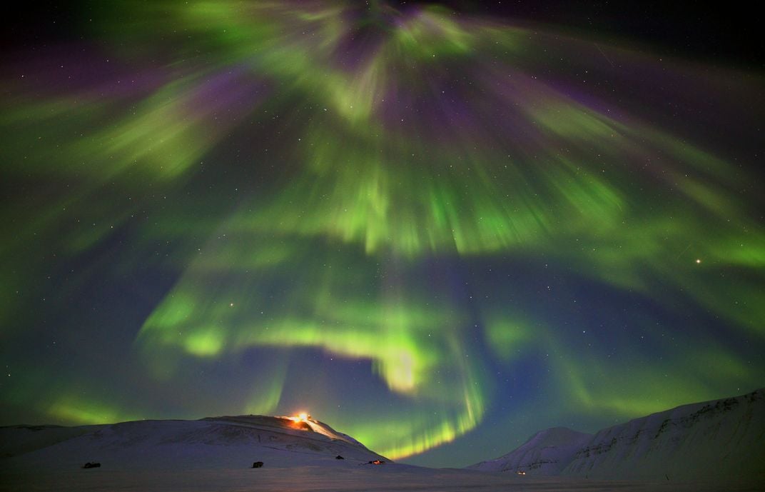 the night sky illuminated by Northern Lights