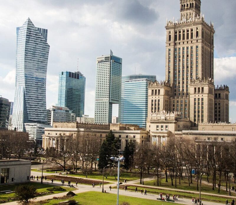 high rises and old clock tower in warsaw