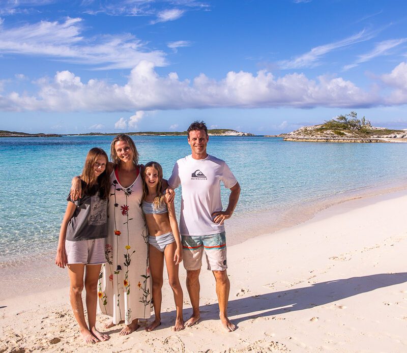 Family getting a photo at the beach