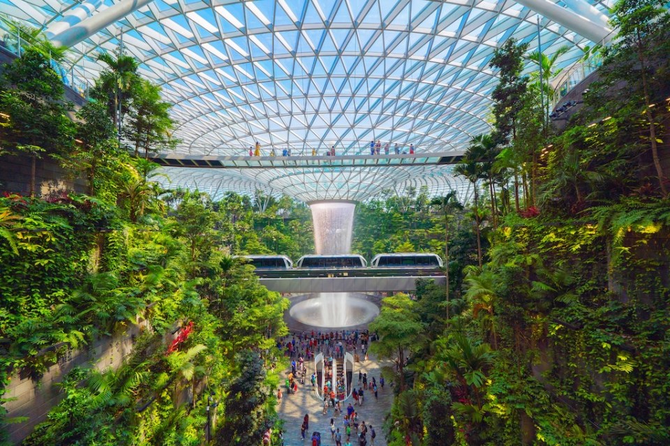 Jewel Changi Airport in Singapore City. Interior design decoration with waterfall, garden and trees. The world's best airport and destination