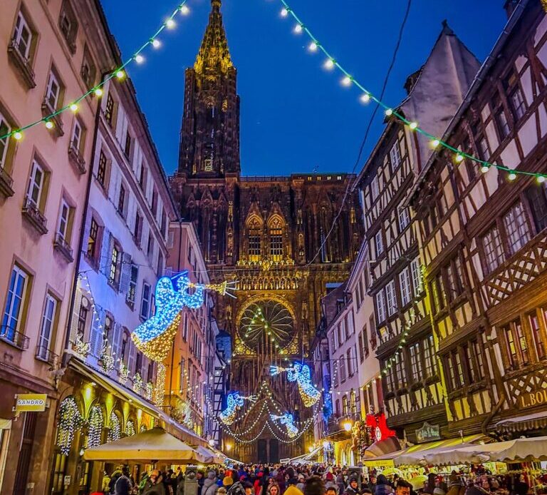 Strasbourg Christmas Market at night with Cathedral backdrop
