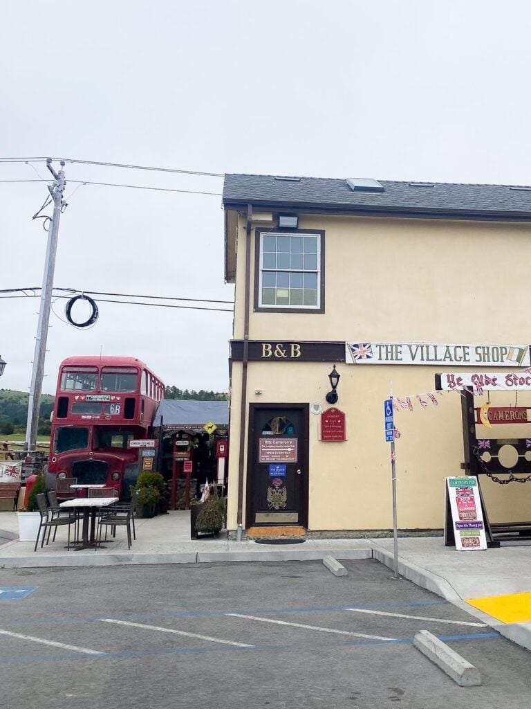 Cameron's Pub in Half Moon Bay with Union Jack flags and vintage bus