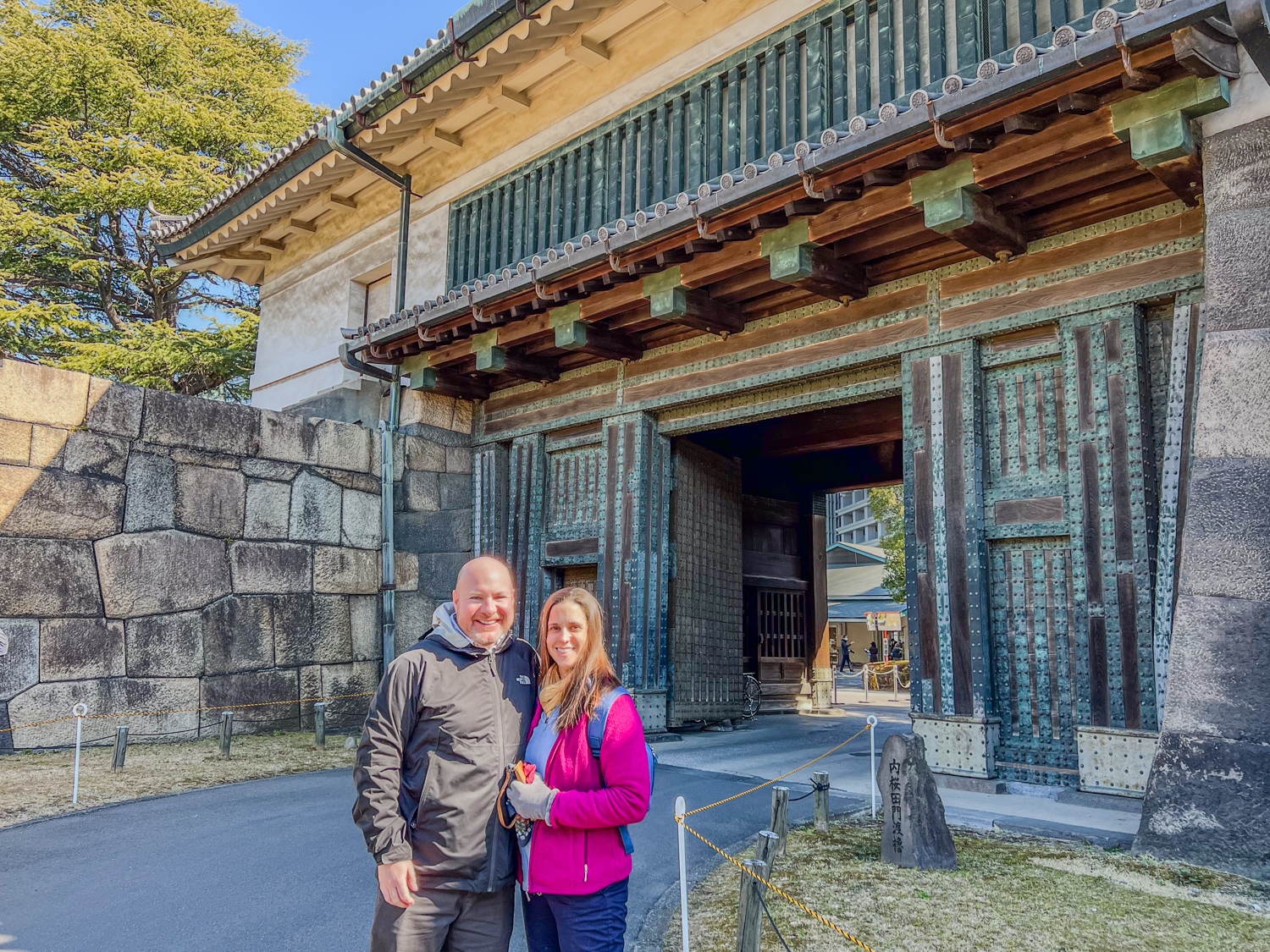 Dave and Kel at the Kikyo-mon Gate during a free tour of the Imperial Palace in Tokyo, Japan