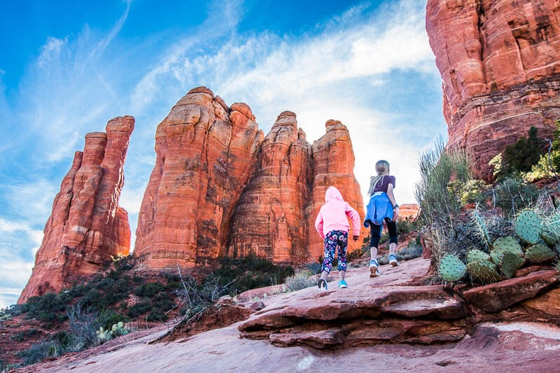 two girls hiking up Sedona Cathedral Rock Hike with kids top things to do in arizona