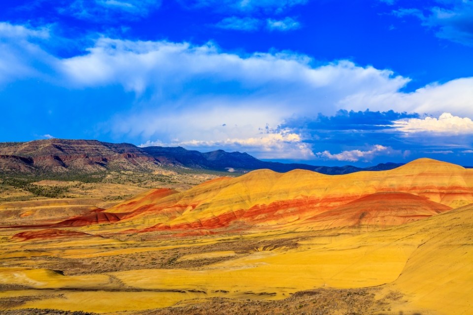 Colorful painted hills at John Day Fossil Beds National Monument, OregonTaken at summer time near sunset, blue sky and colorful cloud in the background.