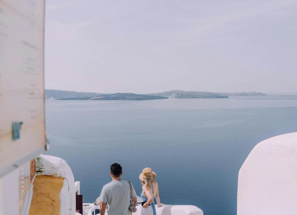 Couple Walking Down the Stairs in Santorini, Greece