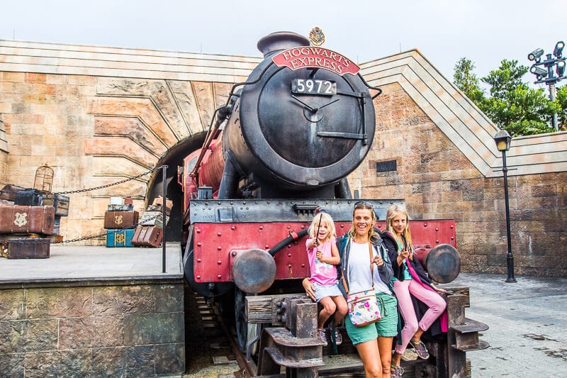 family posing in front of Hogwarts Express, The Wizarding World of Harry Potter, Universal Orlando