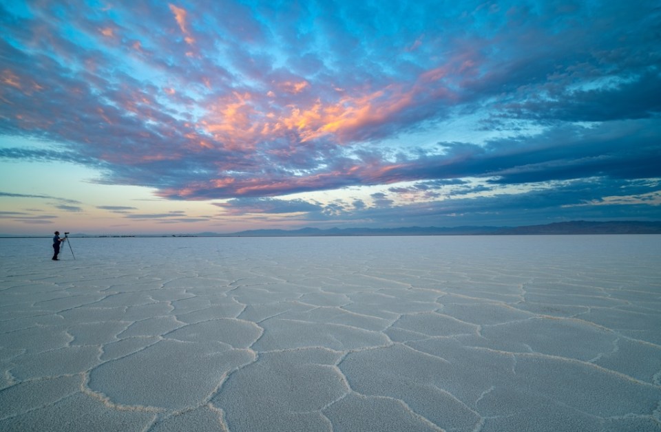Photographer takes pictures of the beautiful sunrise on the Bonneville Sale Flats in Utah