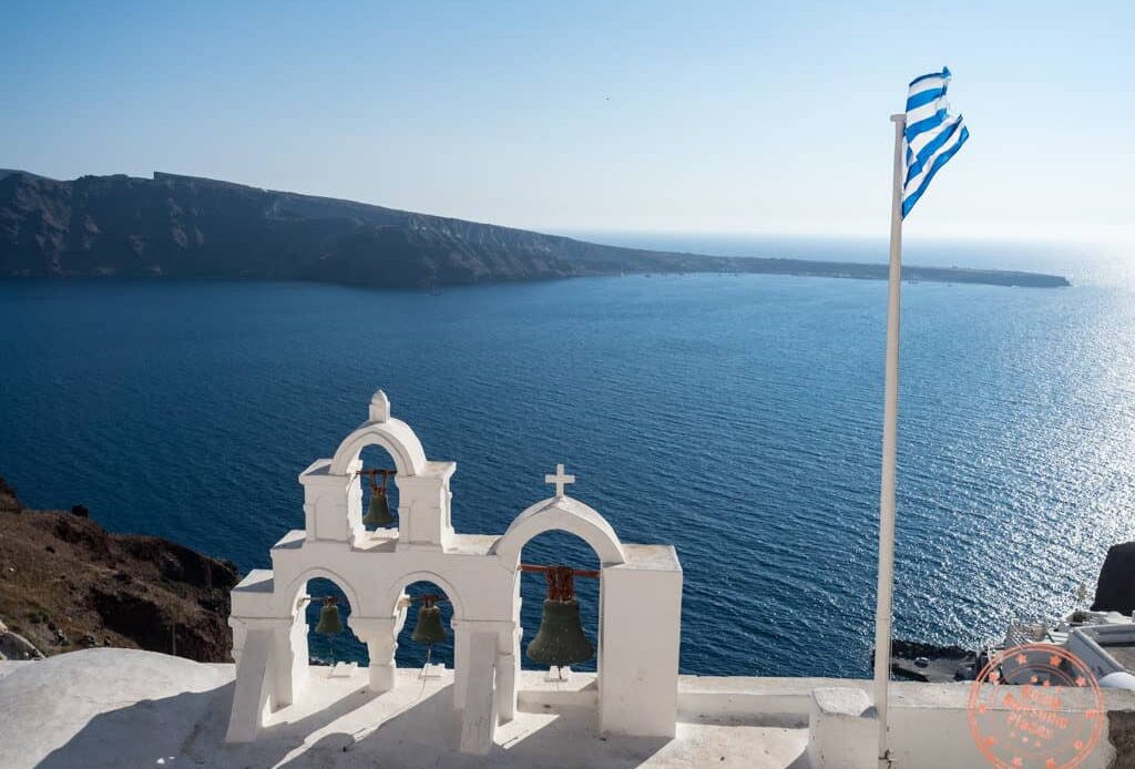 greek islands travel guide oia santorini church flag greece