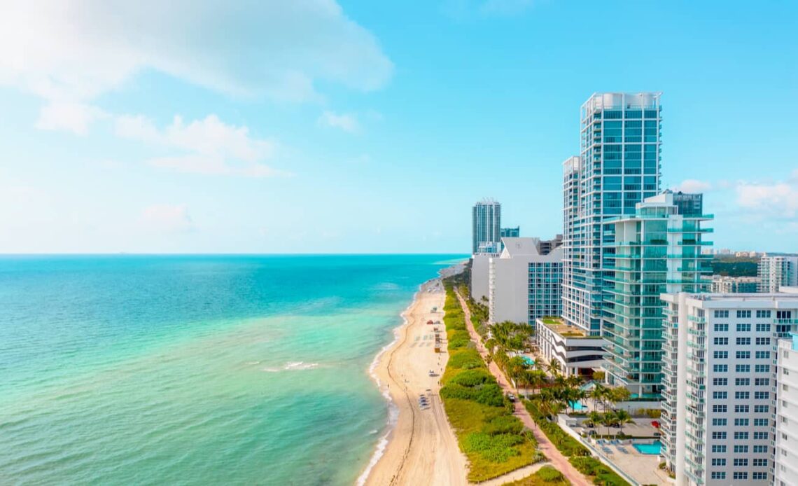 The view overlooking South Beach in Miami, with towering hotels lining the long, sandy beach by the ocean