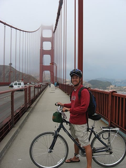 man with bike on golden gate bridge