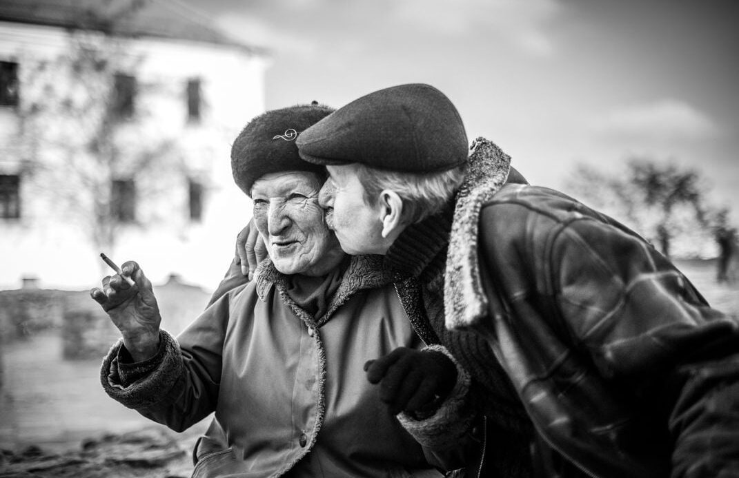 2 - A mature couple enjoys a public smooch on Valentine’s Day. There’s no age limit on love and affection.