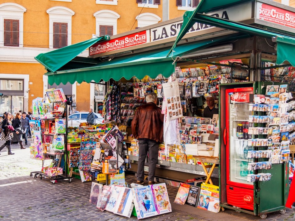 A booth selling the press and souvenir products in the downtown Rome