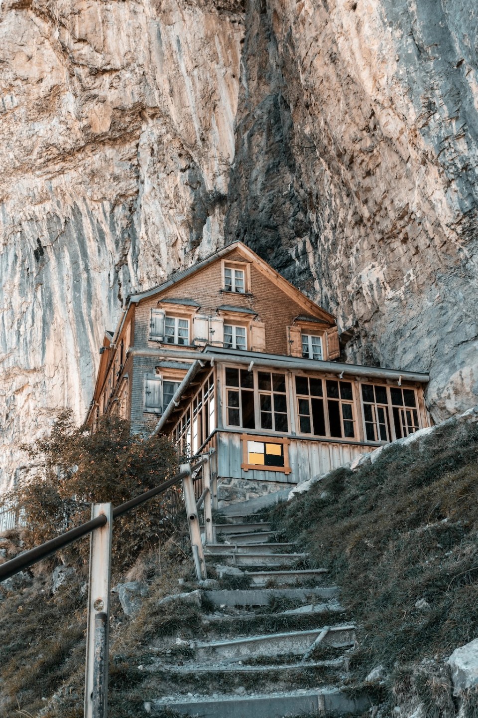 Switzerland, Ebenalp - September 27, 2018: famous mountain inn Aescher-Wildkirchli at the Ebenalp cliffs