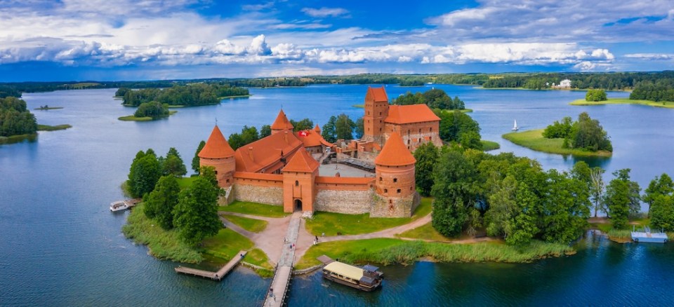 Aerial view of Trakai, over medieval gothic Island castle in Galve lake. Flat lay of the most beautiful Lithuanian landmark. Trakai Island Castle, most popular tourist destination in Lithuania