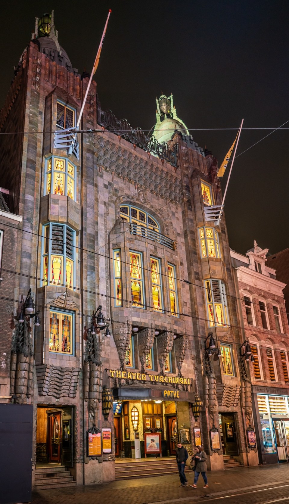 Amsterdam May 18 2018 - Night view of the front of the famous ciname Tuschinski. located at the Reguliersbreestraat near the Rembrandtplein
