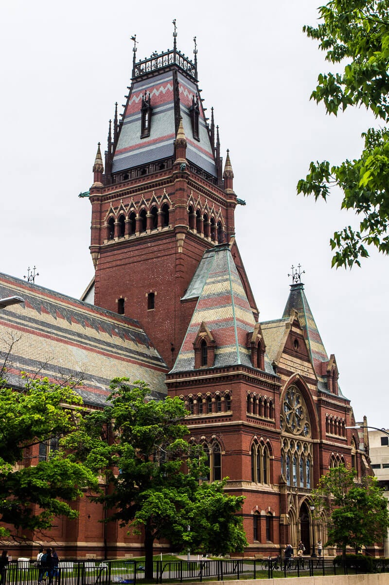 A large clock tower in front of a building