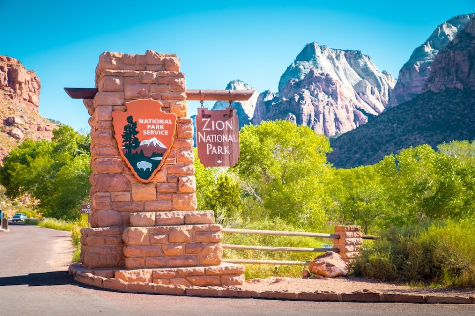Zion National Park entrance monument sign on a beautiful sunny day with blue sky in summer, Utah, USA