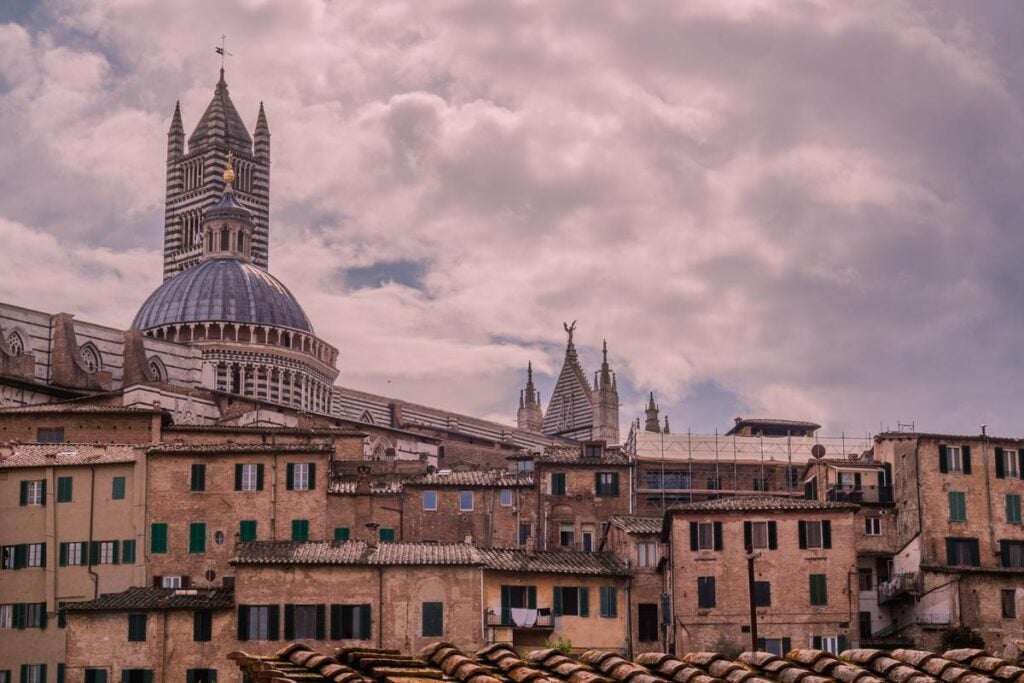Historic Siena skyline with cathedral and terracotta roofs