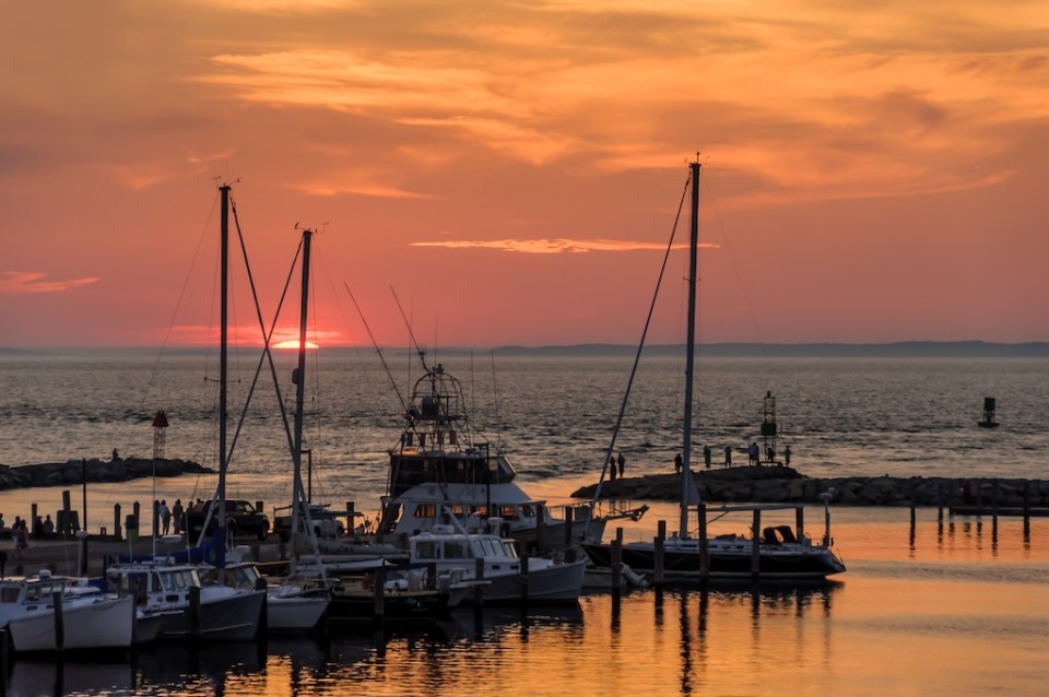 Sunset over the boats in the harbour of the fishing village of Menemsha, Martha's Vineyard Massachusetts USA.