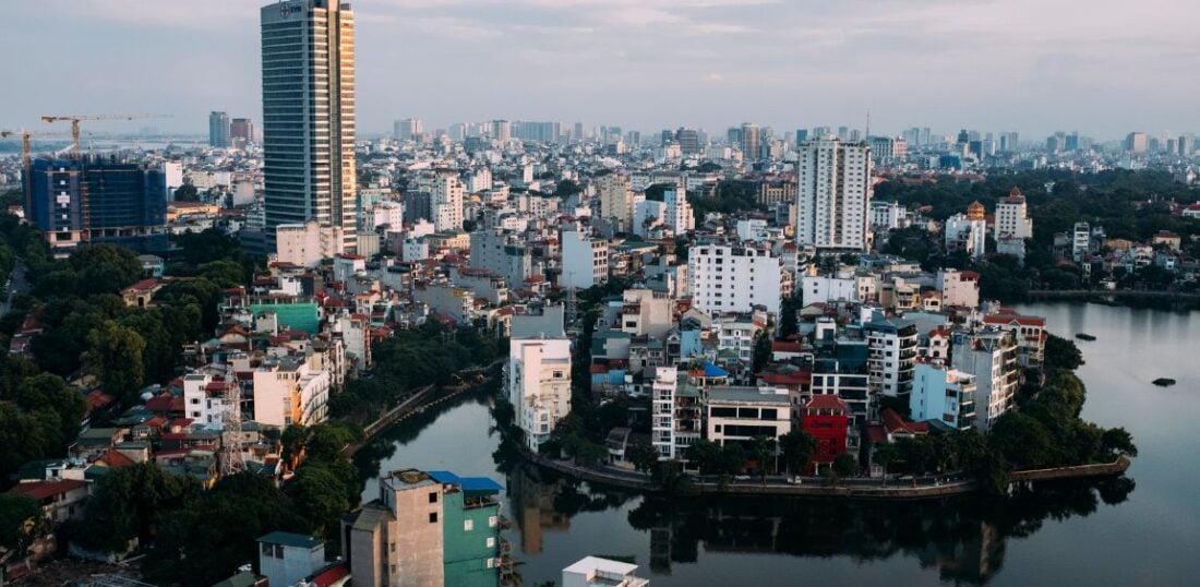 City view of Hanoi featuring river and skyscrapers