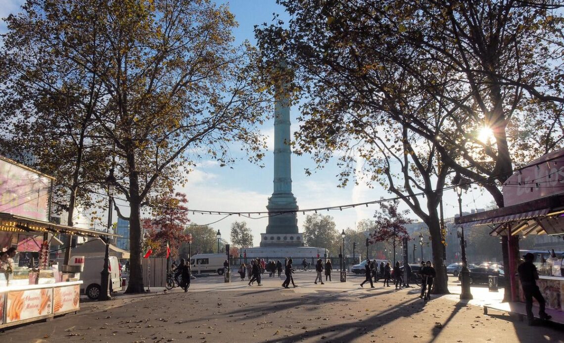 Autumn morning at Place de la Bastille in Paris, featuring the July Column and Parisian street life