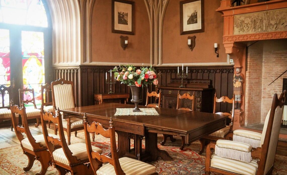 Elegant dining room at Rheinstein Castle, Germany showcasing Gothic Revival architecture and furnishings.