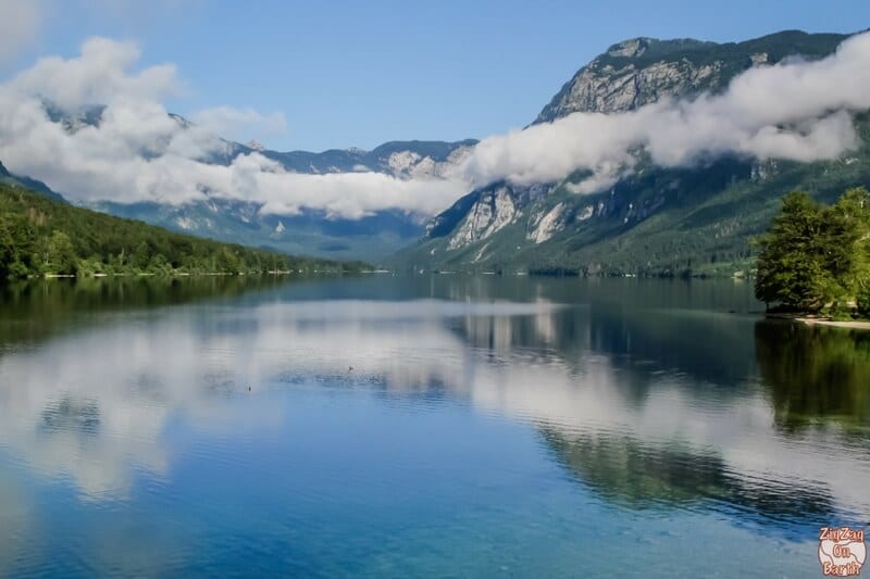 reflections o mountains and low lying clouds in Lake Bohinj 