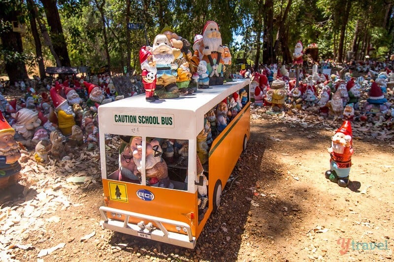 gnome display in garden and in miniature bus Gnomesville,