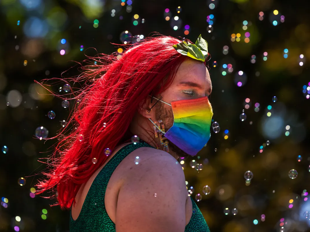 The sunlight catches bubbles afloat during a Pride event in Seattle.